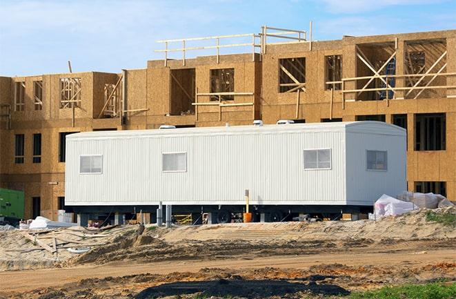 construction workers meeting at office trailers on rent in Rialto, CA